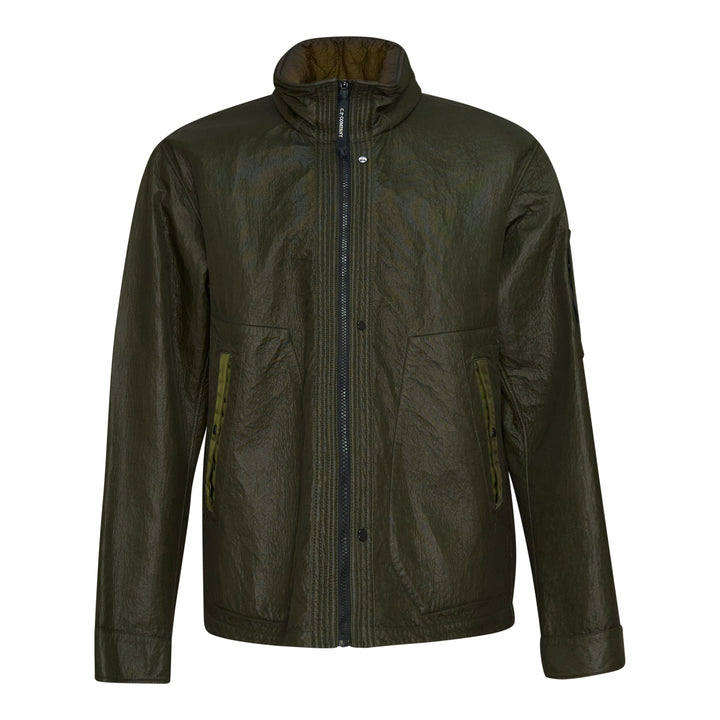 C.P. Company Bi-Face Reversible Jacket in olive coated technical nylon, featuring a stand collar, branded zip fastening, front zip pockets with webbing pulls, and a sleeve lens pocket detail