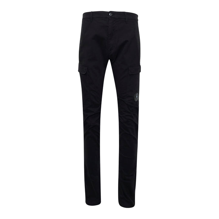C.P. Company Stretch Sateen Ergonomic Cargo Pants in black, featuring a slim fit, flap thigh pockets, and tonal lens badge, shown from the front