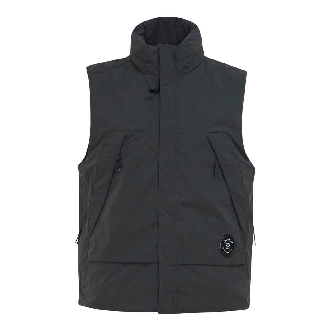 C.P. Company Pro-Tek Primaloft Silver Vest in dark grey, front view, showing stand collar, hidden zip placket, chest zip pockets, lower patch pockets, and NFC badge at the hem