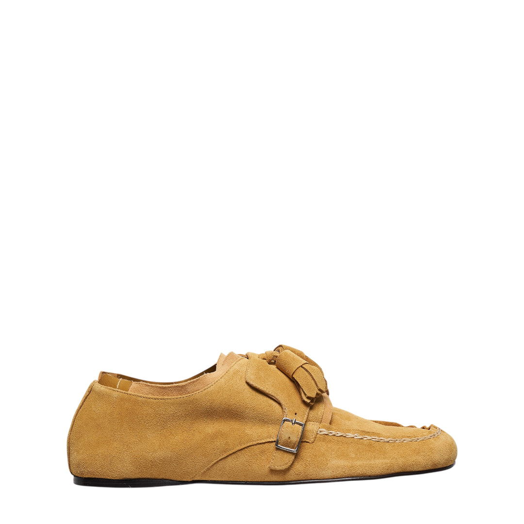 Sonia Carrasco Tassel Strap Loafer in camel tan suede with oversized tassel detail, single monk strap with silver buckle, and moccasin hand-stitched welt — side profile view