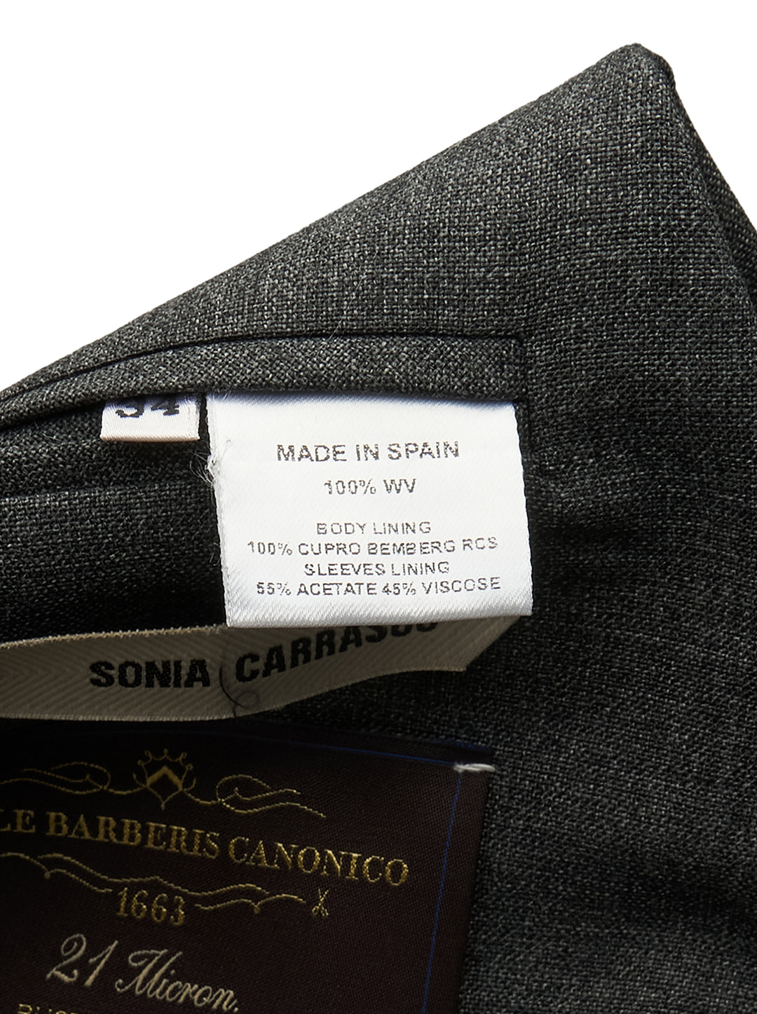 Sonia Carrasco Side Cut Blazer Vest in charcoal grey with open side panels revealing cream canvas interfacing and ribbon trim, notched lapel, and two-button front closure - view 3