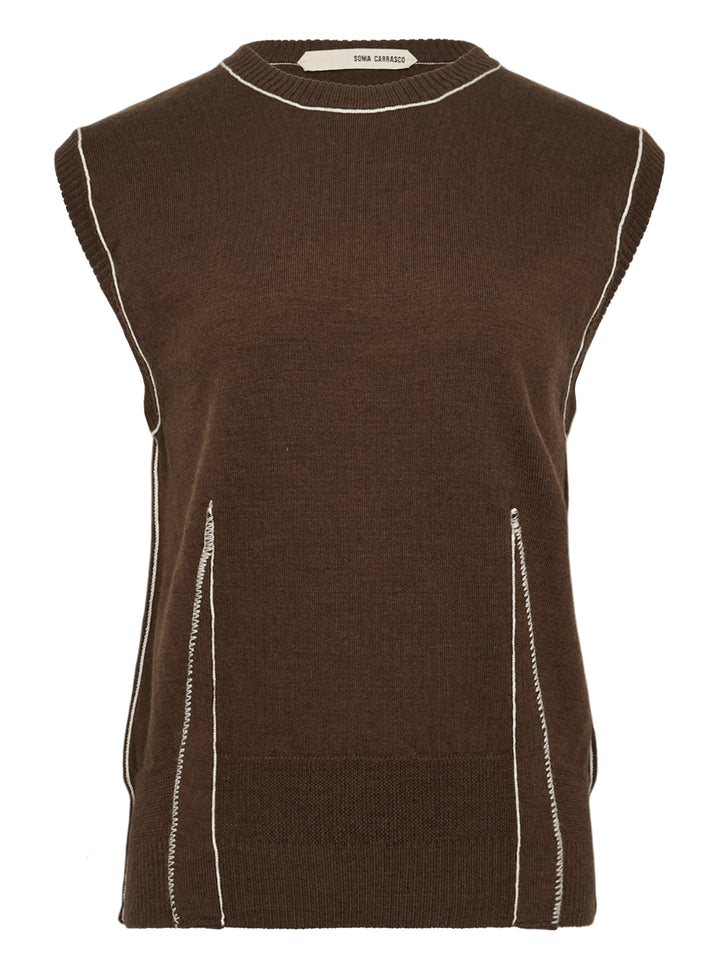 Sonia Carrasco Fitting Knit Vest in chocolate brown with cream contrast topstitching along the neckline, armholes, and diagonal pocket openings, photographed flat on a white background
