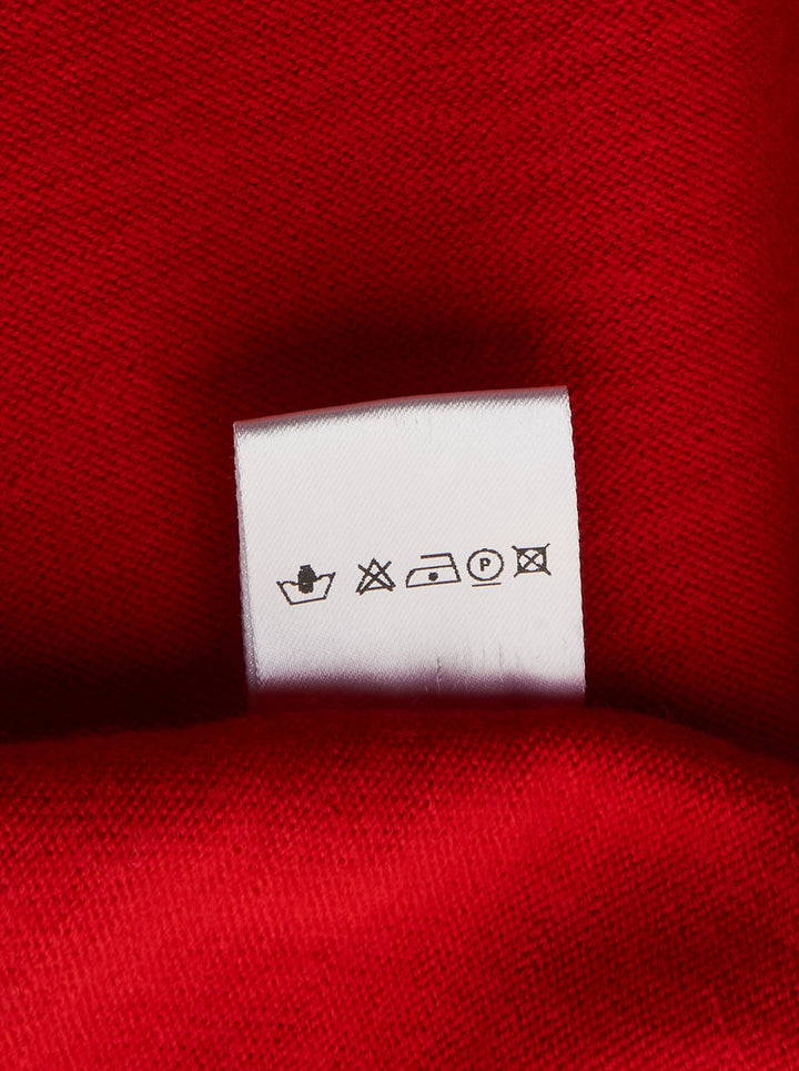 Sonia Carrasco Fitting Knit Vest in red with contrast cream piping along the neckline, armholes, side seams, and front pockets, displayed flat on a white background - view 3