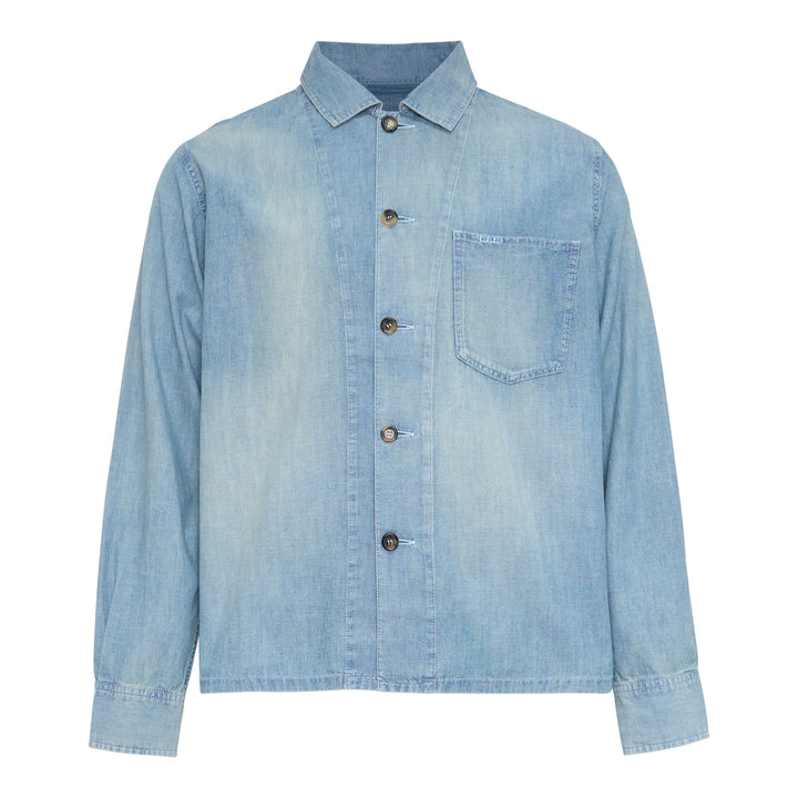JW Anderson Slant Pocket Chambray Shirt in washed light blue denim, featuring a point collar, button-front closure, and a patch chest pocket