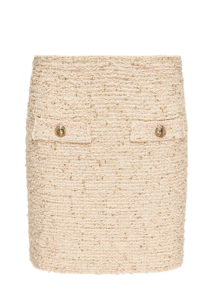 Balmain cream tweed knit mini skirt with gold metallic flecks and two flap pockets with embossed gold-tone buttons