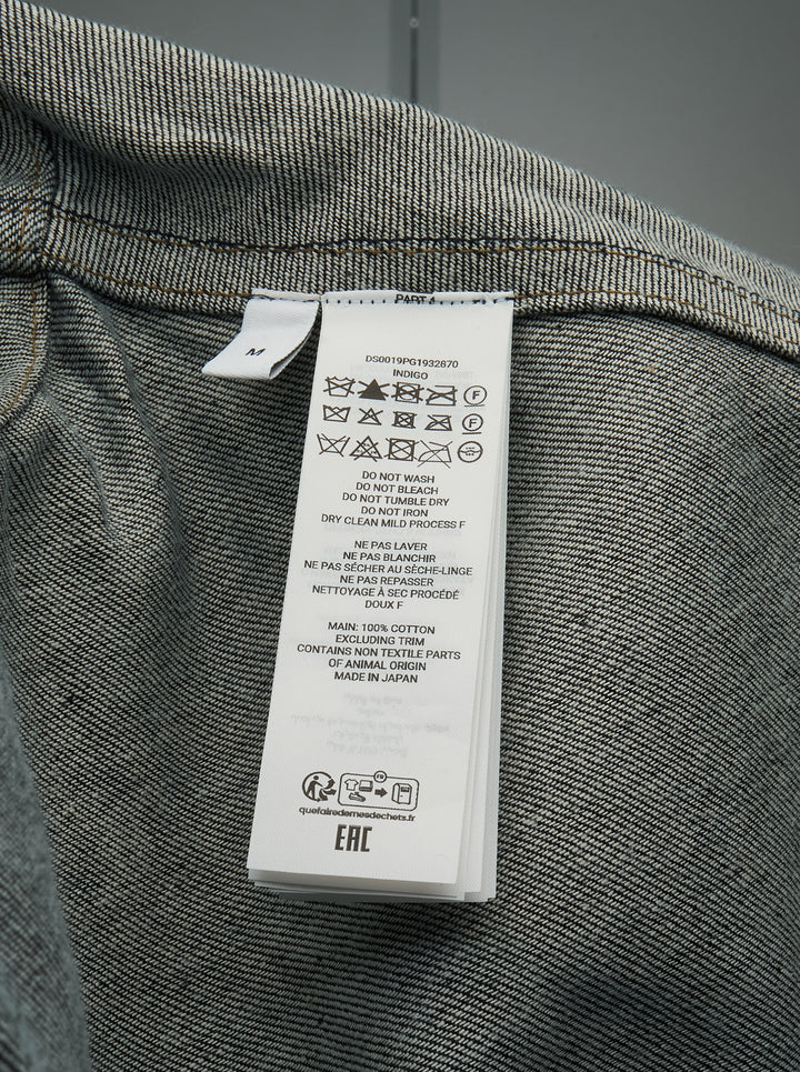 JW Anderson dark indigo lightweight denim flare hem shirt with detached dropped sleeves, cropped body, point collar, patch chest pocket, and mixed mother-of-pearl button fastening — front view - view 3