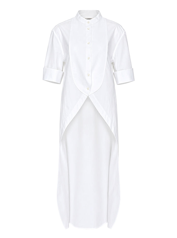 JW Anderson white cotton poplin bib shirt with mandarin collar, button front, short cuffed sleeves and a high-low tailcoat hem