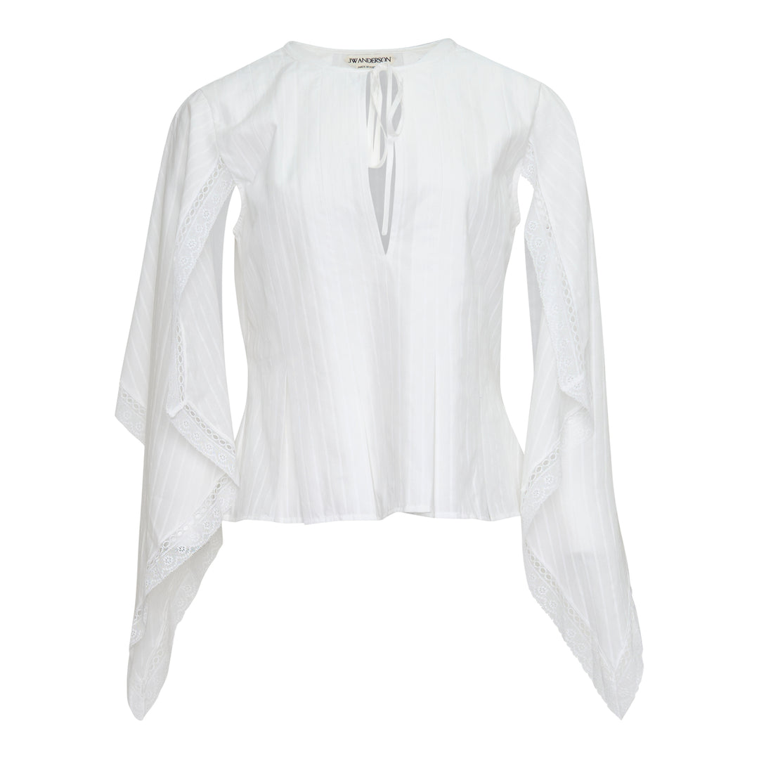 JW Anderson white woven top with dramatic draped handkerchief sleeves trimmed in broderie anglaise lace, fitted pintucked bodice, and a V-neckline with self-tie ribbon closure