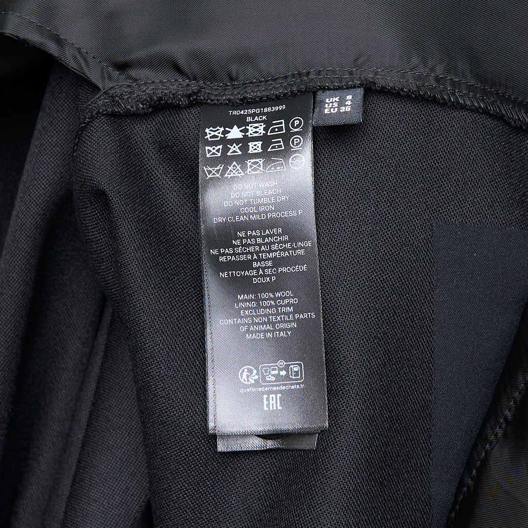 JW Anderson black fold over wide-leg trousers with draped waistband and side zip fastening, cropped length, shown on white background