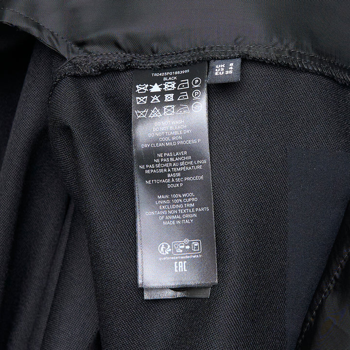 JW Anderson black fold over wide-leg trousers with draped waistband and side zip fastening, cropped length, shown on white background