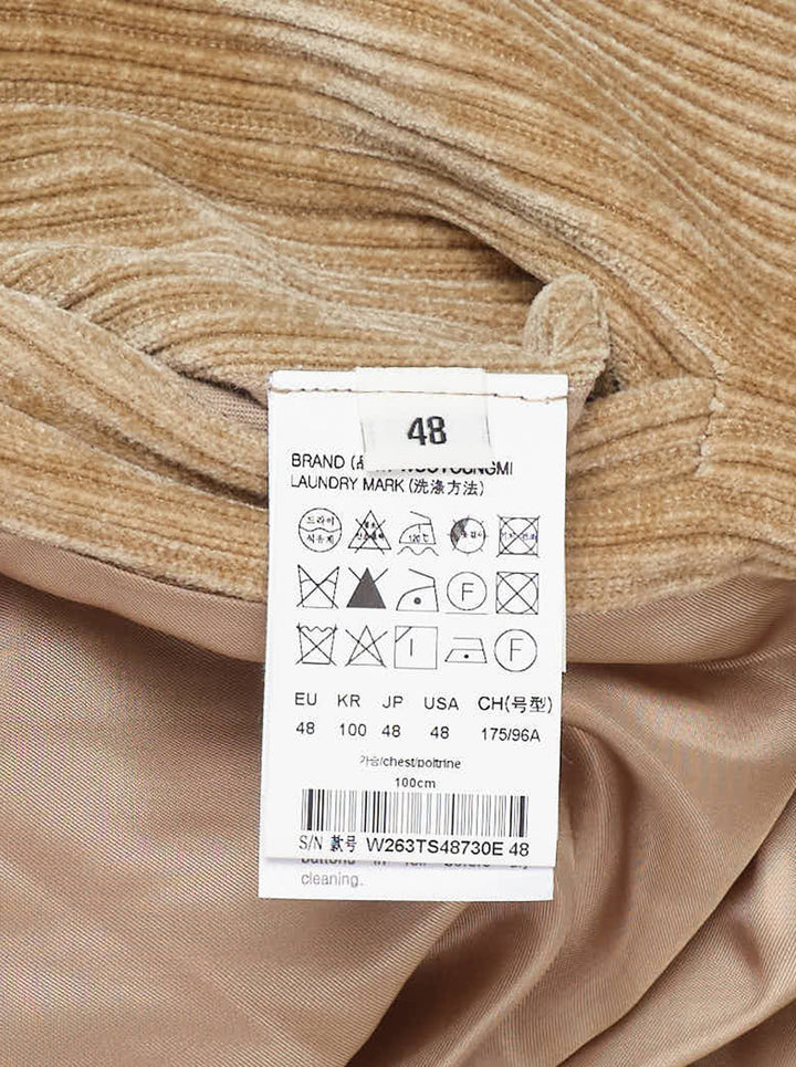 Wooyoungmi Flock Corduroy Track Pants in sand, featuring a wide-wale ribbed texture, elasticated waistband, and straight-leg silhouette with metal hardware label detail - view 3