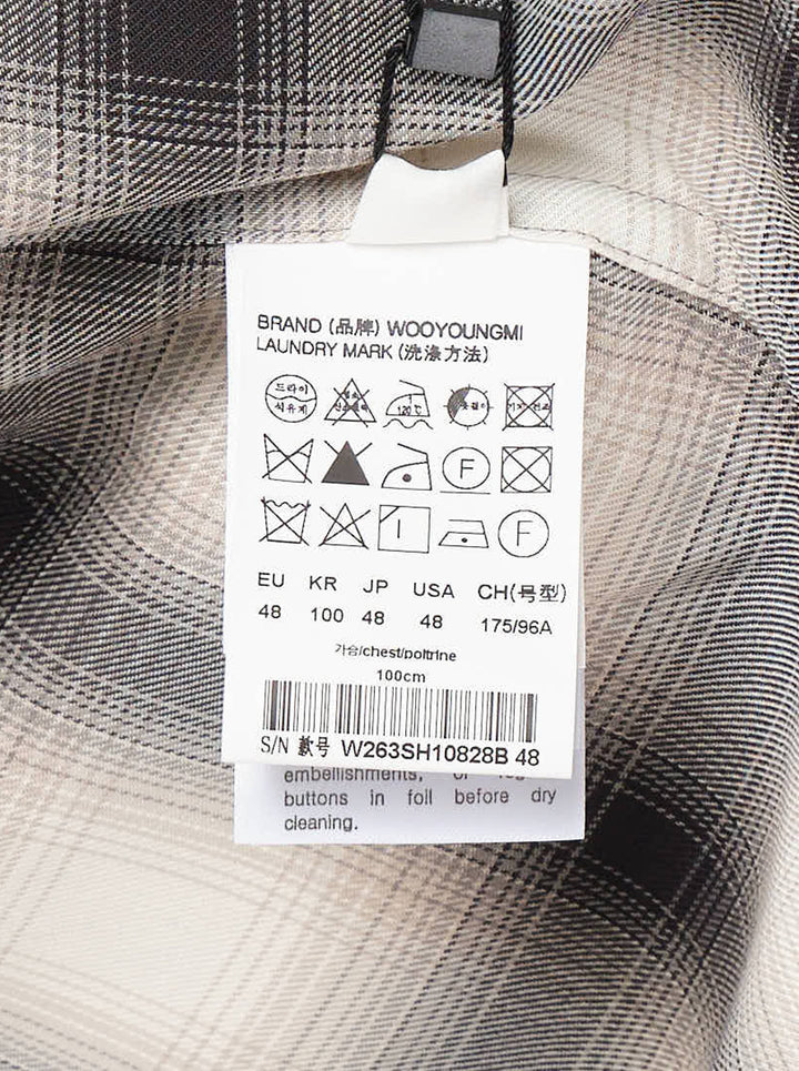 Wooyoungmi ombré shadow plaid long sleeve shirt in cream and charcoal, featuring a point collar, full button placket with gunmetal buttons, chest patch pocket, and a curved hem - view 3