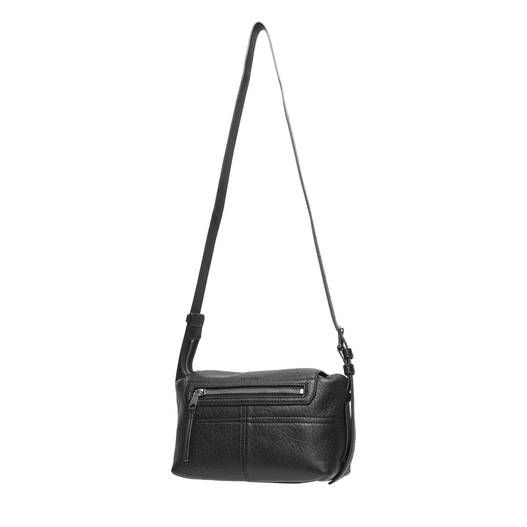 Lemaire Mini Soft Gear Bag in black pebbled leather with dual front push-lock pockets, central flap closure, and long adjustable crossbody strap with silver-tone hardware