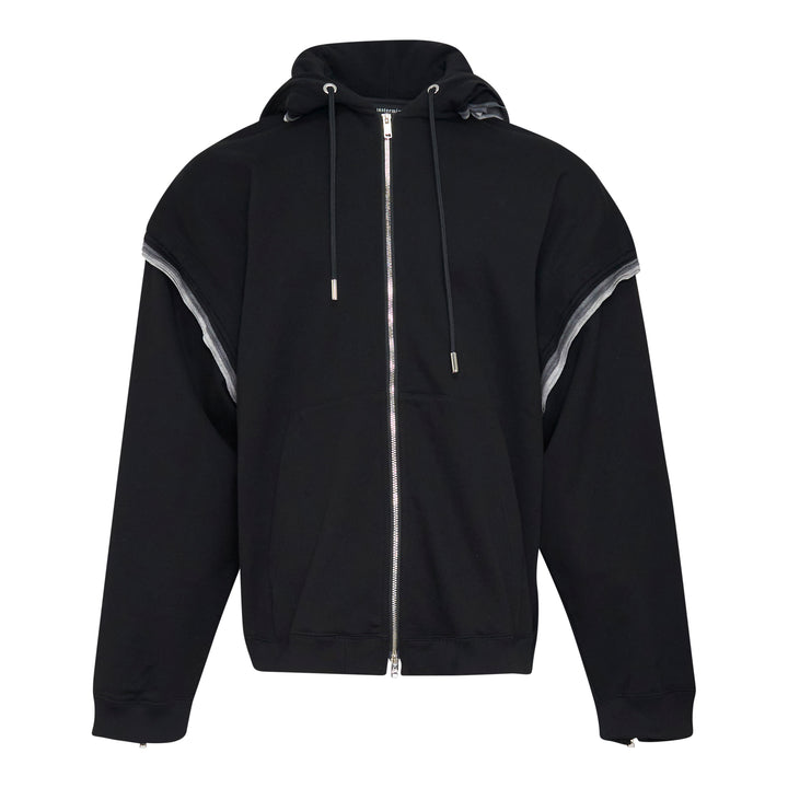 Mastermind Millefeuille Zip-Up Hoodie in black, featuring a two-way silver zip, drawstring hood, and exposed raw-edge layered detail along the shoulder and sleeve seams