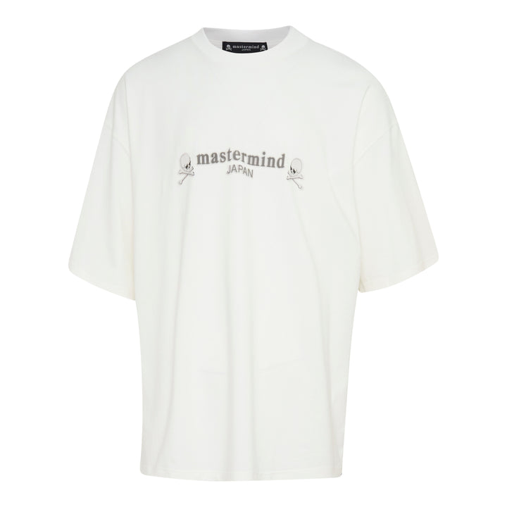 Mastermind Japan Boxy Short Sleeve Tee in off-white with tonal arched logo embroidery and skull-and-crossbones motifs at the chest