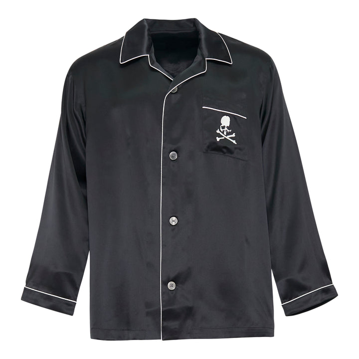 Mastermind black satin pajama set with skull and crossbones embroidery on the chest pocket, white contrast piping trim, button-front long-sleeve top, and relaxed wide-leg trousers