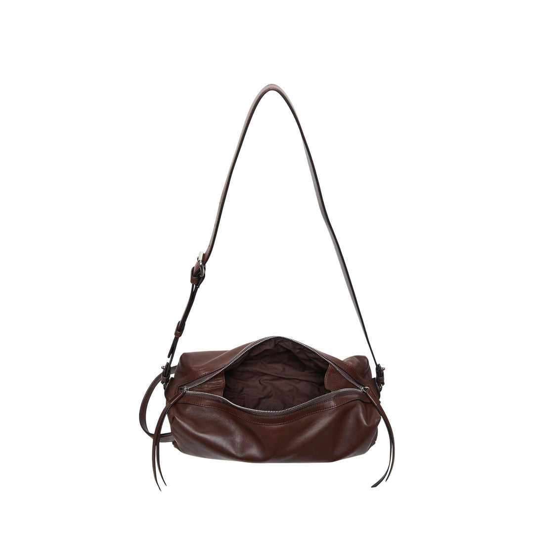 Lemaire Care Sling Bag in dark brown nappa lambskin with adjustable crossbody strap and zip closure, front view on white background