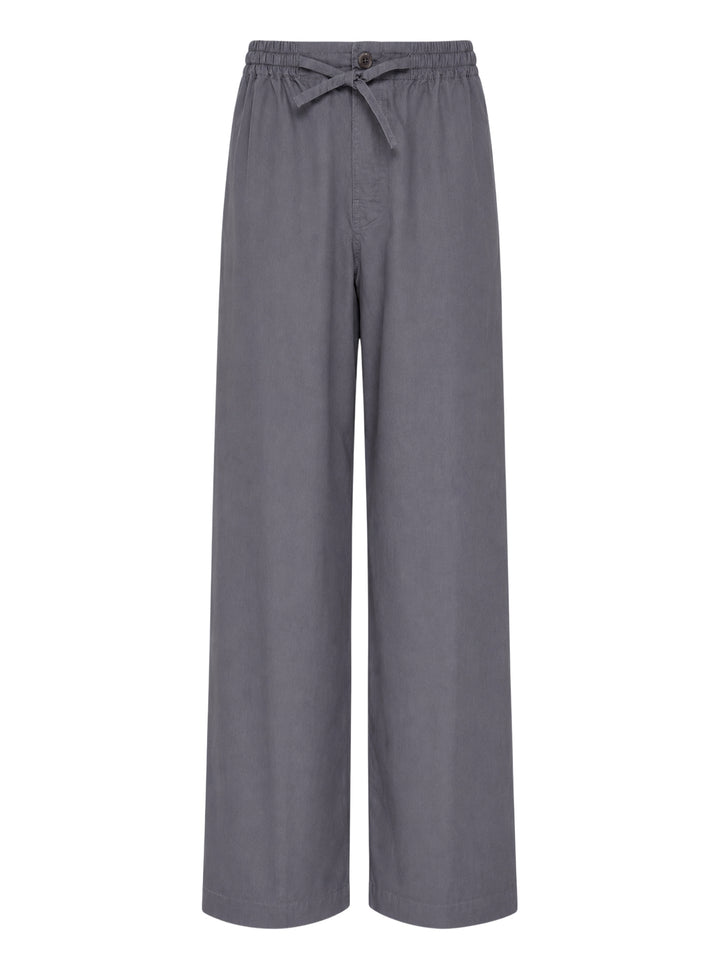 Lemaire Light Cotton Pyjama Pants in slate grey, featuring a wide-leg silhouette, elasticated waistband, and tonal drawstring tie with single button fastening