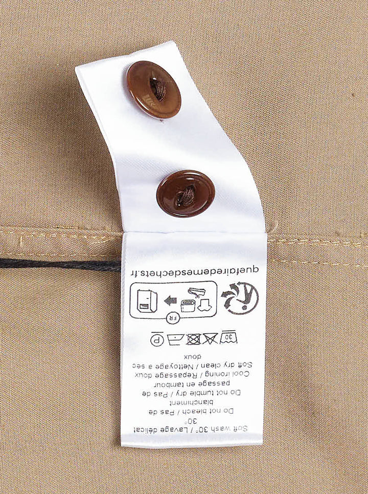 Lemaire Two Pockets Long Sleeve Shirt in tan cotton with dual patch chest pockets, dark tortoiseshell buttons, and a relaxed boxy silhouette, shown on a white background - view 4