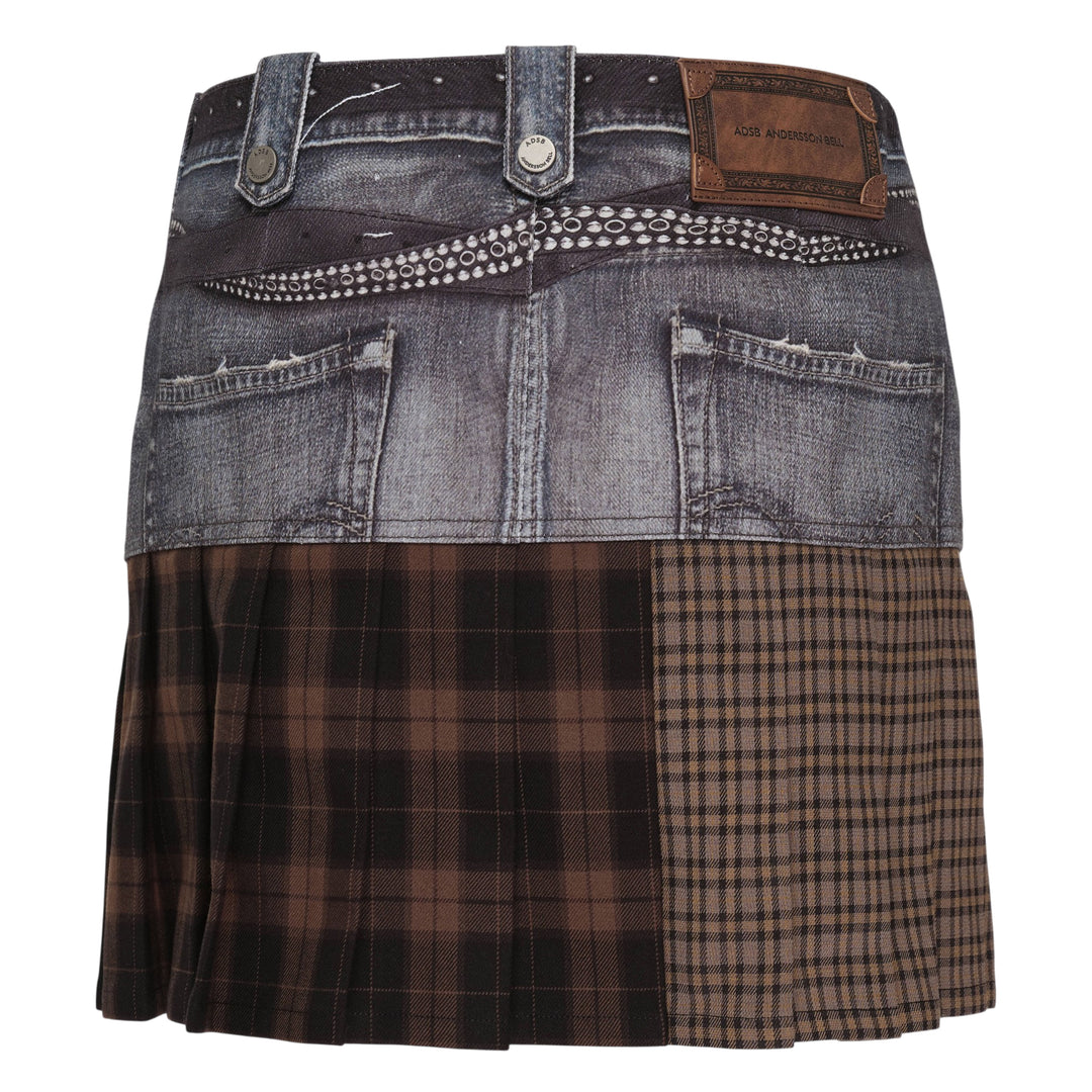 Andersson Bell Double Belt Printed Mini Skirt featuring a printed washed-denim upper panel with rhinestone double belt detail and an asymmetric mixed brown tartan pleated hem, photographed flat on a white background
