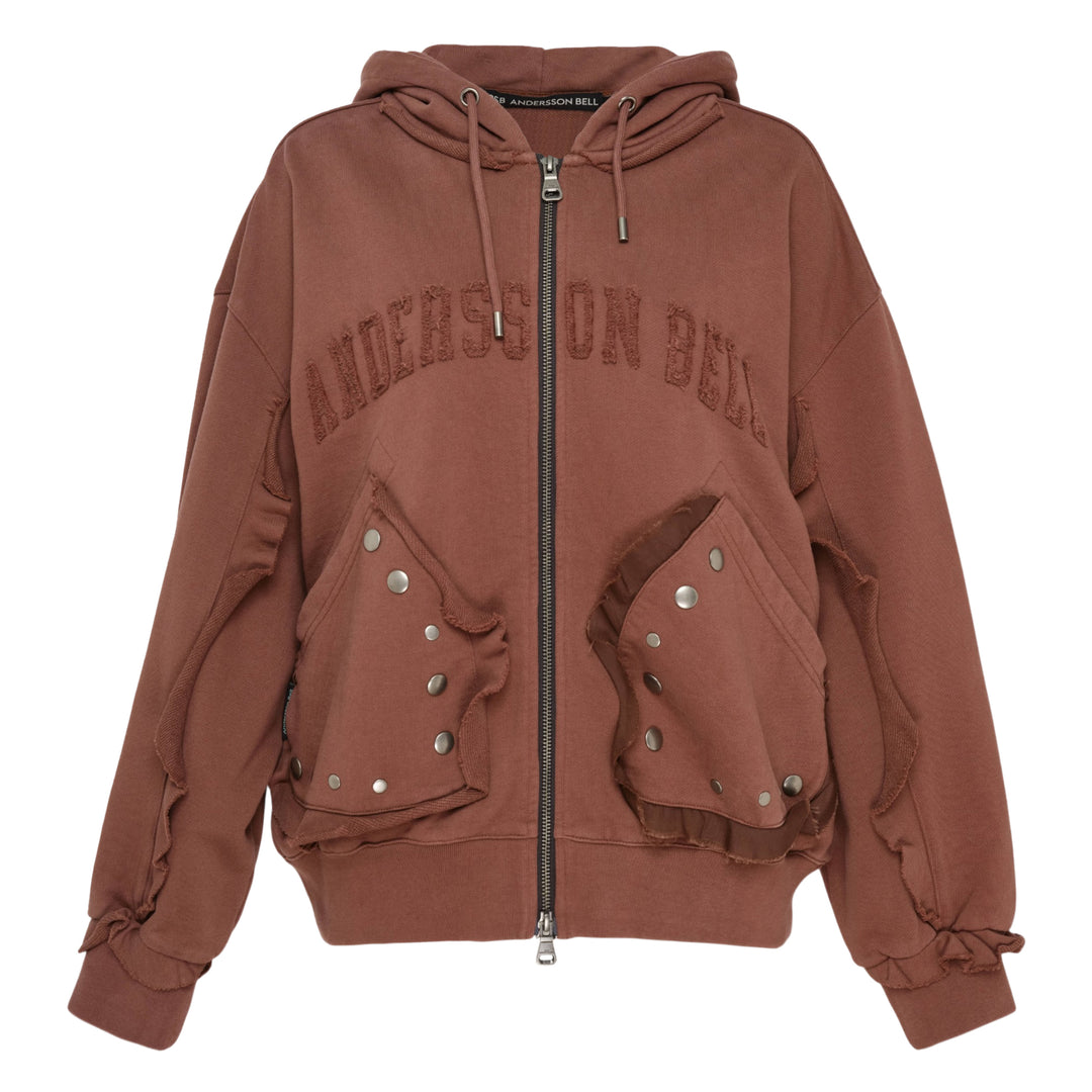 Andersson Bell Raw-Cut Studded Zip-Up Hoodie in dark brown with tonal collegiate embroidery, gunmetal-studded raw-cut pockets, and tie-detail cuffs