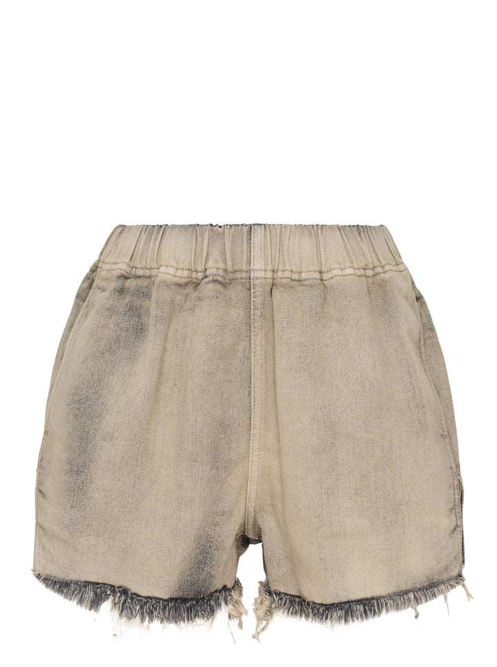 Rick Owens mineral wash denim shorts with elasticated waistband and raw frayed hem in washed beige-grey tone, back view on white background