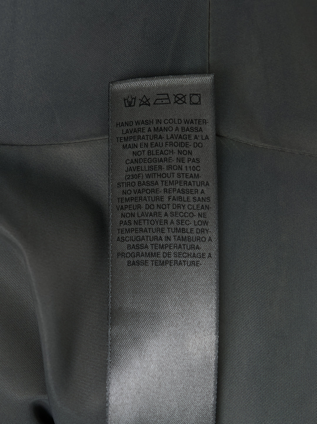 Rick Owens washed bomber cowl cape with sculptural folded funnel neck and side patches, shown flat against a white background - view 3