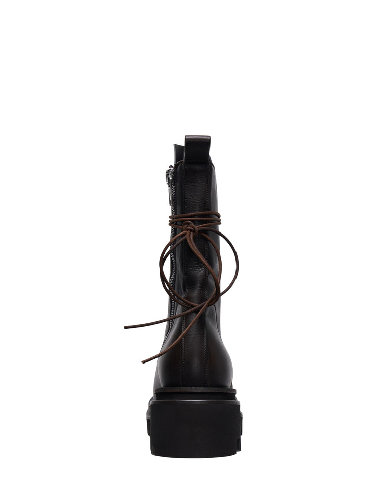 Rick Owens Bogun mid-calf lace-up boots in dark washed calf leather, featuring silver hook hardware, wrap-around brown leather lacing with a raw knot, and an exaggerated black lugged platform sole - view 3