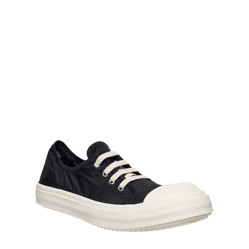 Rick Owens Tower Low Sneaker in black gathered nylon with cream rope laces, oversized ivory sculpted toe cap, and serrated rubber outsole, side profile view - view 2