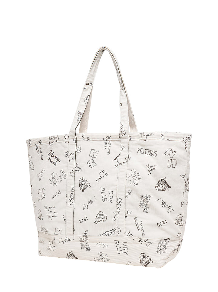 Human Made ivory corduroy tote bag with all-over hand-drawn Dry Alls graphics and an embroidered red heart logo - view 2