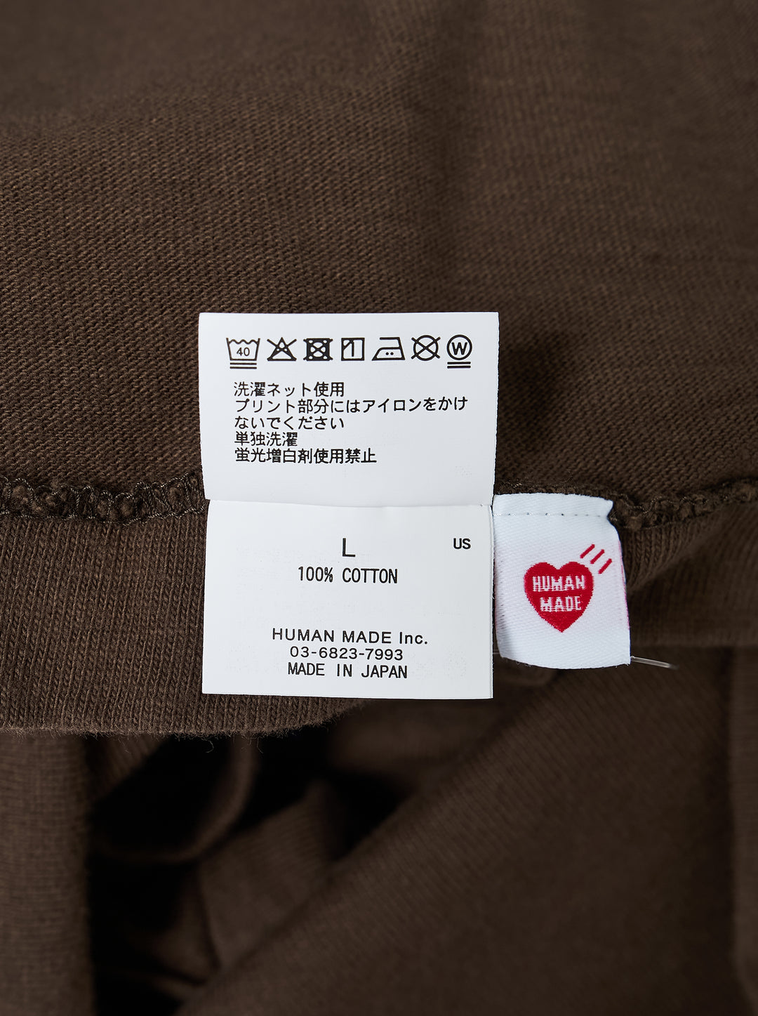 Human Made brown short-sleeve graphic T-shirt with an orange heart logo print at the chest and a red woven label at the neck - view 3