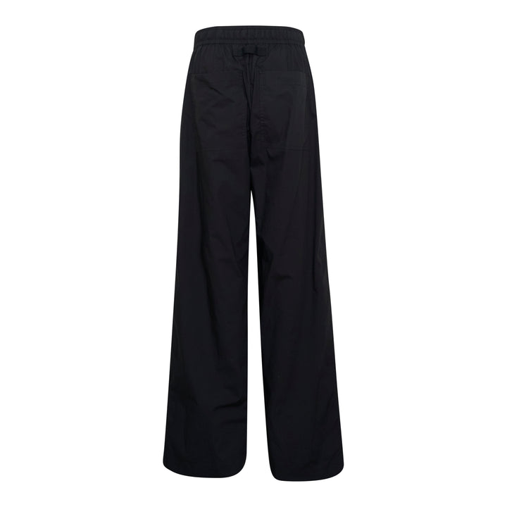 Lee Mathews Poplin Wide Leg Pants in black with cream drawstring waistband, featuring a relaxed wide-leg silhouette and centre-front seam detail