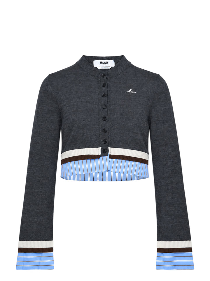 MSGM cropped charcoal knit cardigan with button-through front, contrast pale blue pinstripe shirting panels at hem and cuffs, and cream and dark brown stripe trim