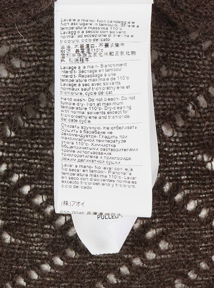 MSGM dark brown chevron pointelle knit midi skirt with ribbed waistband, pearl pin detail, and fluted ruffle hem trim, shown flat on white background - view 5