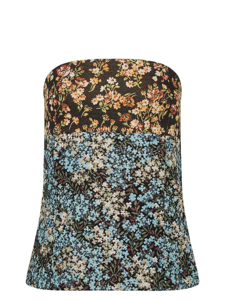 Dries Van Noten structured strapless bustier top in mixed floral jacquard patchwork, featuring a dark-ground botanical upper panel and a blue-ground meadow floral lower panel with a gently flared silhouette