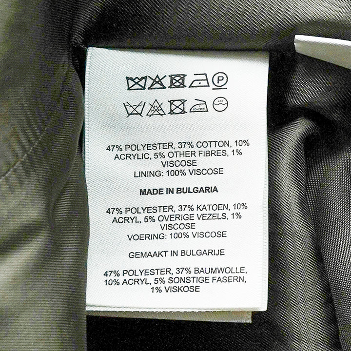 Dries Van Noten floral jacquard straight midi skirt with double-breasted button placket, flap pockets, belt loops with contrast ribbon belt, and front hem pleats, displayed flat on a white background - view 3