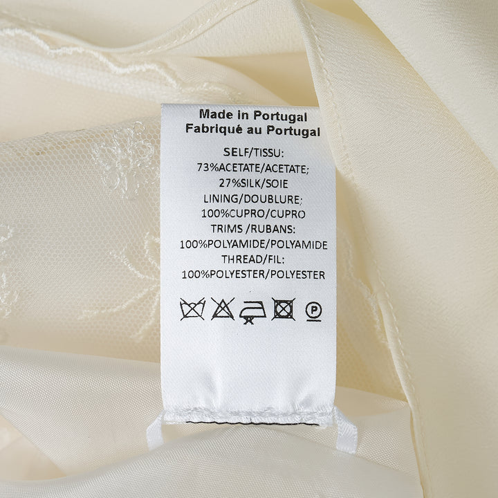 Simone Rocha ivory crepe negligee midi skirt with elasticated waist and floral embroidered lace scalloped hem trim, flat lay on white background