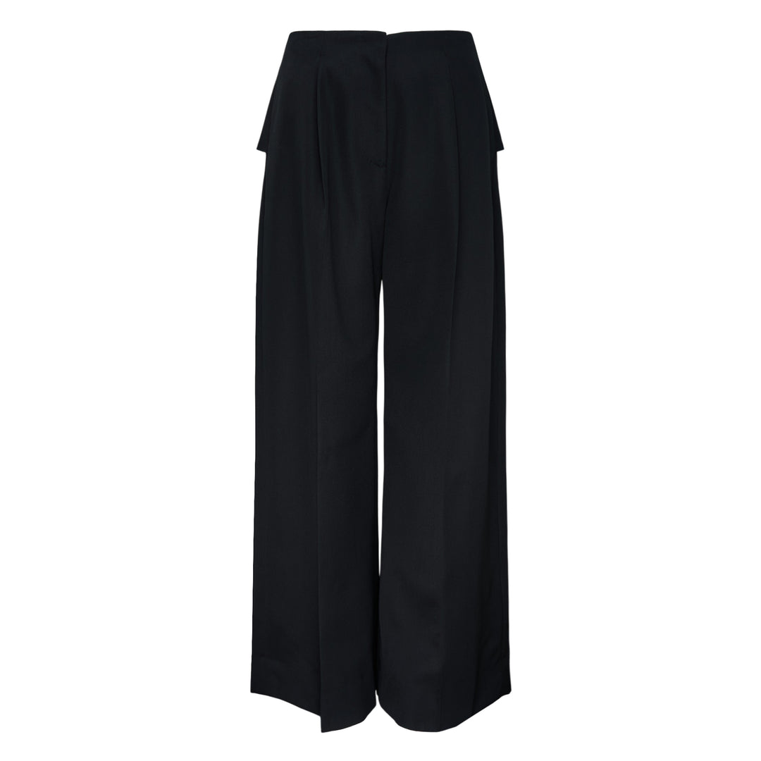 Simone Rocha Back Bow Wide Leg Trousers in black, featuring deep front pleats, a high waist, and a fluid wide-leg silhouette with a signature bow detail at the back