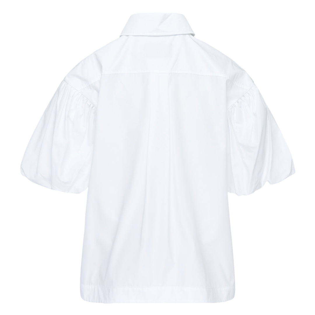 Simone Rocha white cropped blouse with voluminous pleated puff sleeves and an oversized 3D rosette corsage with ribbon detail on the chest