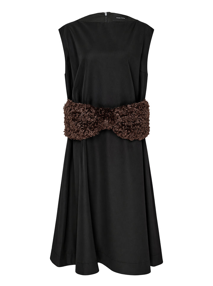 Simone Rocha sleeveless black dress with a boxy peplum silhouette and an oversized brown curled faux fur bow at the waist