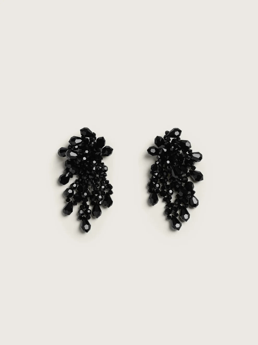 Pair of Simone Rocha Wilted Chandelier earrings in black, featuring cascading faceted crystal beads and teardrops on a light background