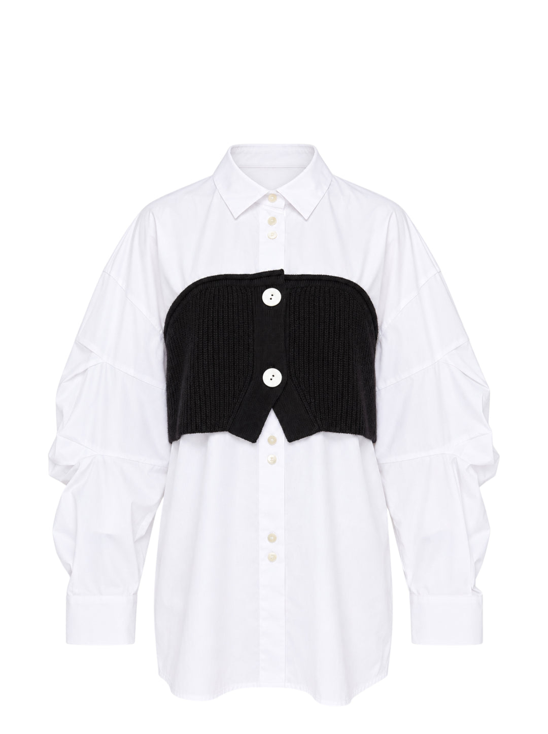 Enfold Knitted Docking Shirt — white cotton poplin long-sleeve shirt with integrated black ribbed knit bandeau panel featuring mother-of-pearl buttons and ruched sleeves, flat lay on white background