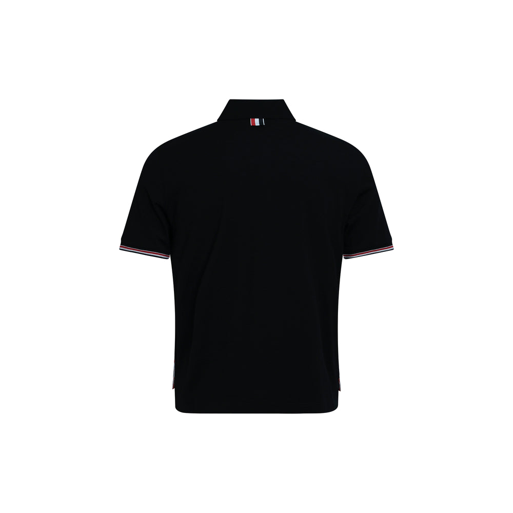 Thom Browne black piqué short sleeve polo with signature red, white, and blue rib cuff tipping and four-button placket, front view on white background - view 2