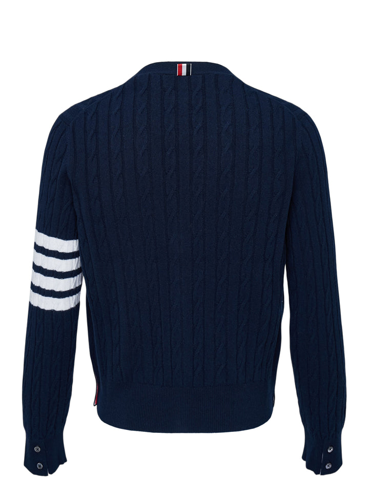 Navy cable-knit V-neck cardigan with white 4-bar stripe on the sleeve, button front and two front pockets - view 2