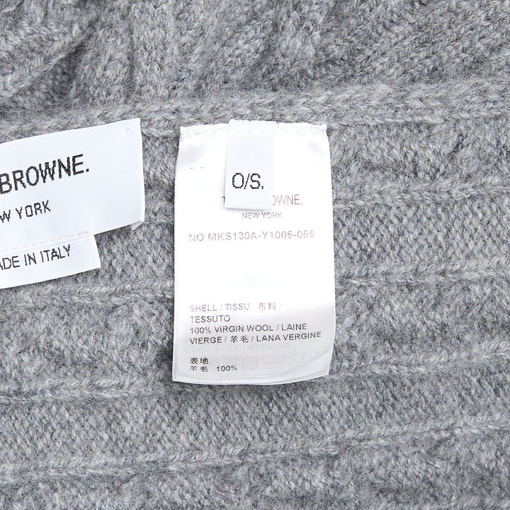 Thom Browne navy cable-knit merino wool scarf with ribbed hem featuring signature red, white, and blue stripe trim and woven brand label tab
