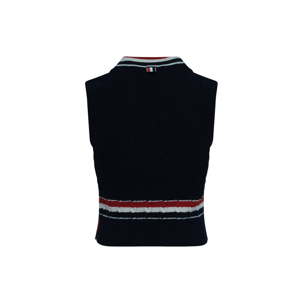 Thom Browne Baby Cable V-Neck Cricket Vest in navy with red, white, and blue stripe trim at the neckline and waistband, sleeveless and cropped fit, made in Italy - view 2