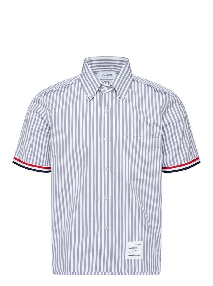Thom Browne straight fit short sleeve button-down shirt in grey and white stripes with red, white and blue grosgrain sleeve trim and chest pocket