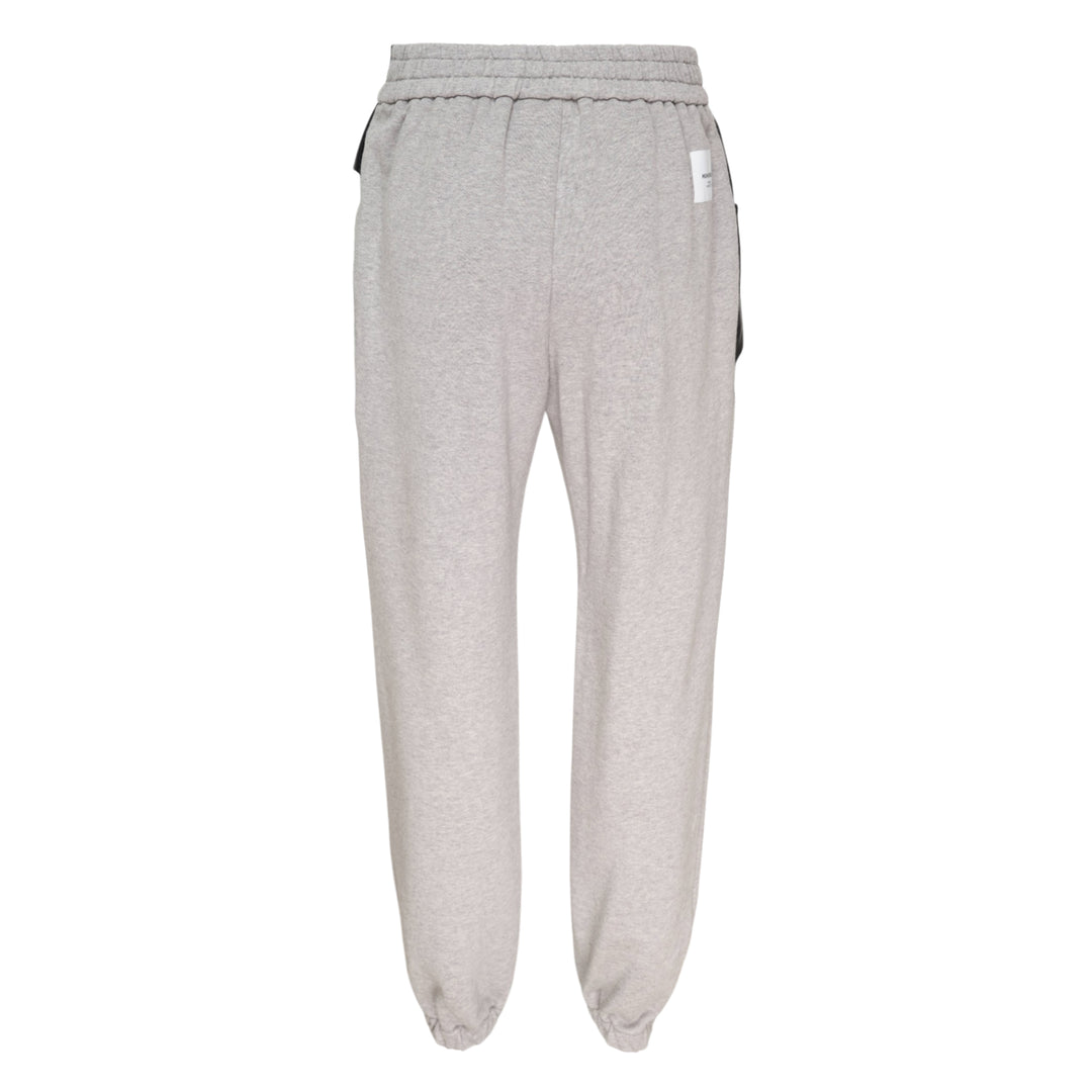 pushBUTTON black faux-leather mini skirt overlay layered over grey marl tapered sweatpants with elasticated cuffs and silver rivet hardware - view 2