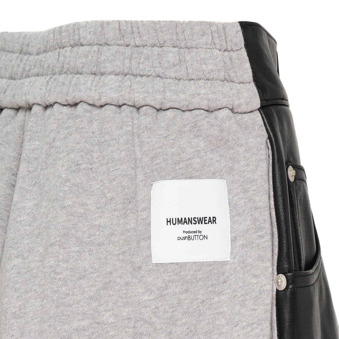 pushBUTTON black faux-leather mini skirt overlay layered over grey marl tapered sweatpants with elasticated cuffs and silver rivet hardware - view 3