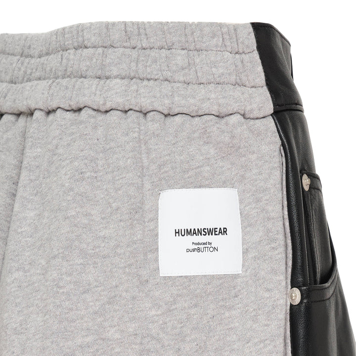pushBUTTON black faux-leather mini skirt overlay layered over grey marl tapered sweatpants with elasticated cuffs and silver rivet hardware - view 3